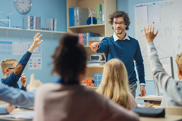 Teacher working with students