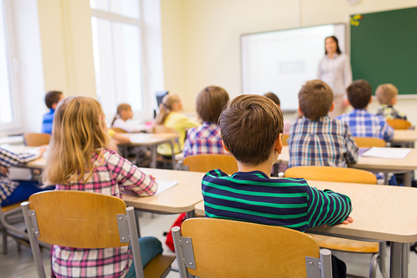 Students sitting at desks in classroom