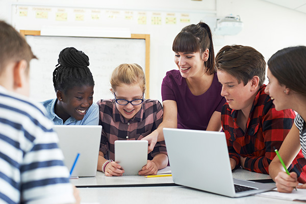 Teacher working with group of students