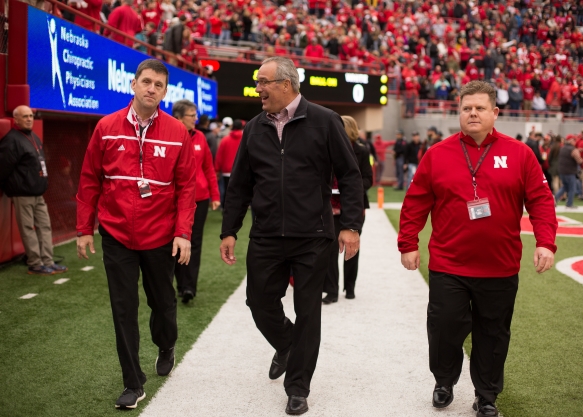 President Bounds and Nebraska Athletic Director Bill Moos walking along the end zone during the Huskers' 2018 Spring Game.