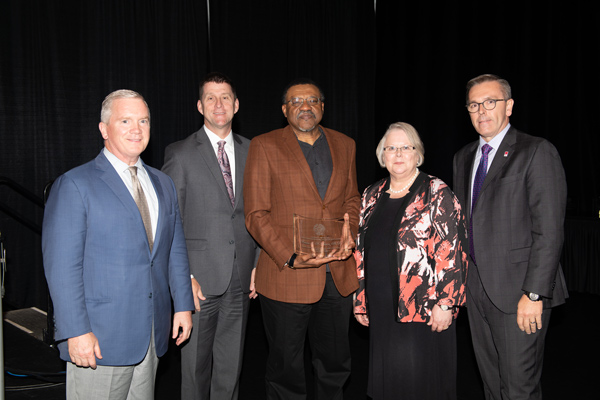 Board of Regents Chairman Tim Clare, President Emeritus Hank Bounds, 2019 ORCA Award Recipient Kwame Dawes, Ph.D. (UNL Chancellor's Professor of English & editor of Prairie Schooner), Interim President Susan Fritz and UNL Chancellor Ronnie Green at the 2019 President's Excellence Awards. 