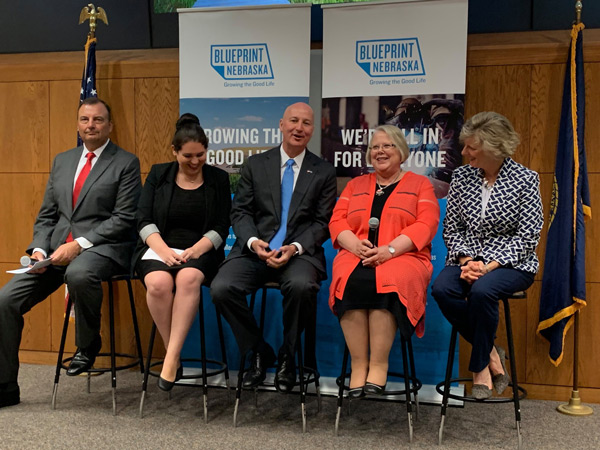 Susan Fritz with Governor Ricketts and others