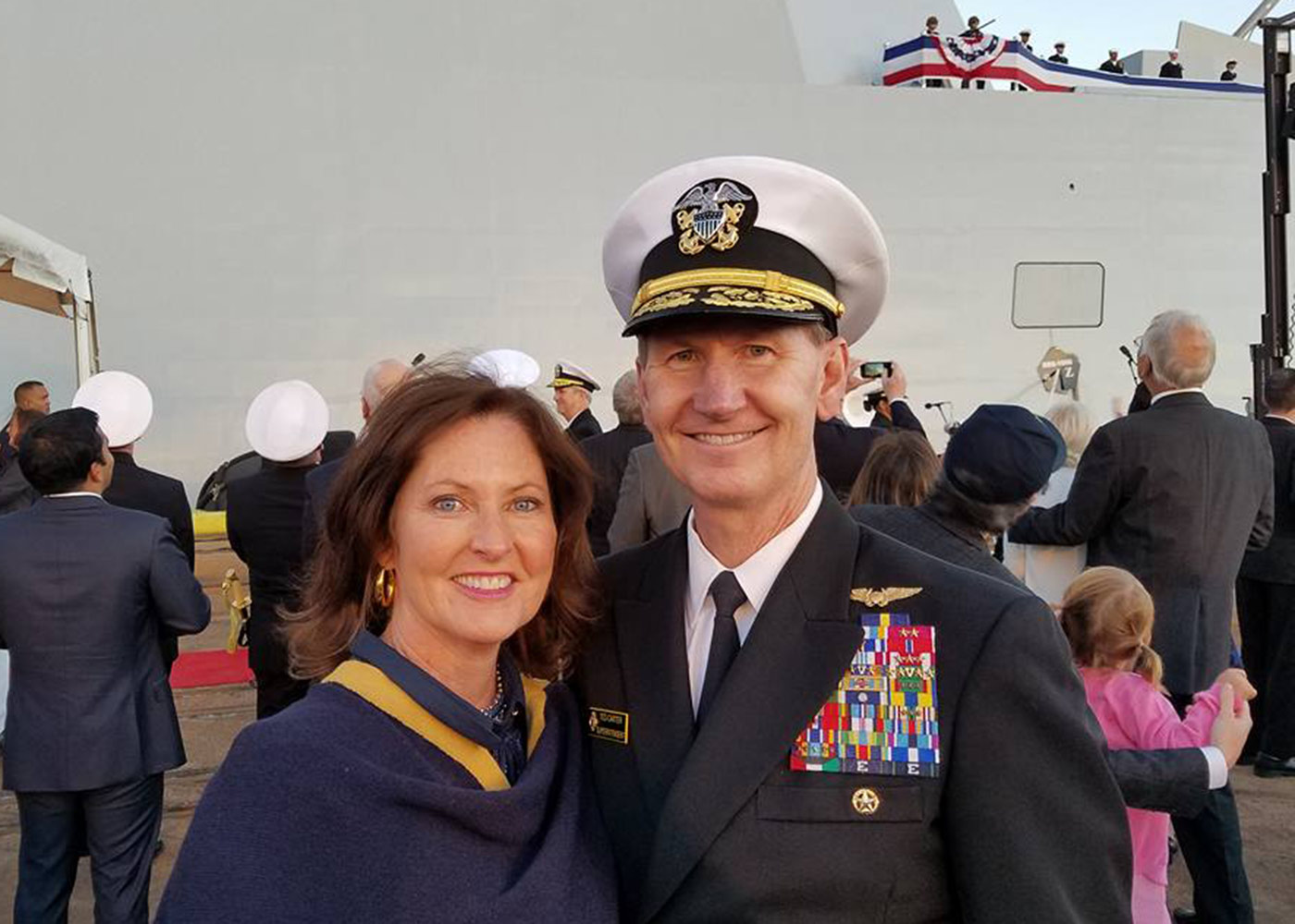 Photo of Lynda and Ted Carter in front of a ship