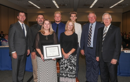 President Hank Bounds; Kirk Huryta, husband; Deborah Huryta, recipient; Karson Huryta, son; Beverly Mathiesen, Aunt and Executive Associate Office of the Chancellor; Keegan Huryta, son; Chancellor Kristensen; Regent Whitehouse.