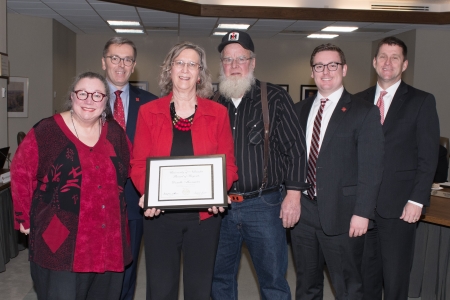 Dawn Braithwaite, Chair of Communication Studies; Chancellor Green; Donelle Moormeier, recipient; Ron Moormeier, husband; Regent Zach; President Bounds.