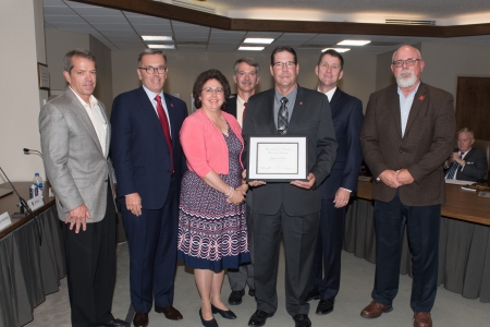 Regent Pillen; Chancellor Green; Robin Perkins, wife; Clint Krehbeil, Department Head Professor, Animal Science; Jeffrey Perkins, recipient; President Bounds; Phillip Miller, Professor Animal Science Swine Nutrition