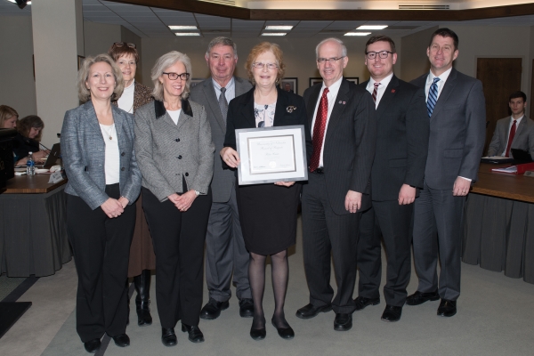 Angela Peppers, supervisor, Dr. Debra Romberger, Chairperson for the Department of Internal Medicine; Selaba Travis, friend; Steve Laire, husband; Rita Laire, recipient; Chancellor Gold; Regent Zach; President Bounds.