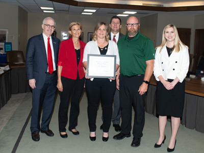 Pictured: Chancellor Gold; LuAnn Larson, Supervisor; Amy Haberman, recipient; President Bounds; Justin Haberman, husband and Regent O’Connor.