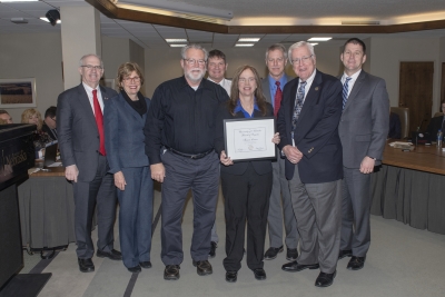 Chancellor Gold; Jennifer Larsen, Vice Chancellor of Research; Ron Larson, husband; Joseph Krajicek, Supervisor, Comparative Medicine Assistant Director of Operations; Theresa Larson, recipient; John Bradfield, Comparative Medicine Director; Regent Phares; President Bounds