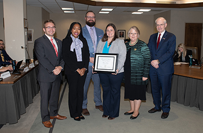 Rebecca Gratz, Multimedia Specialist within the University of Nebraska at Omaha’s Office of University Communications, receiving her KUDO's award.