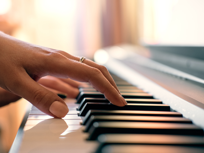 closeup of someone playing piano