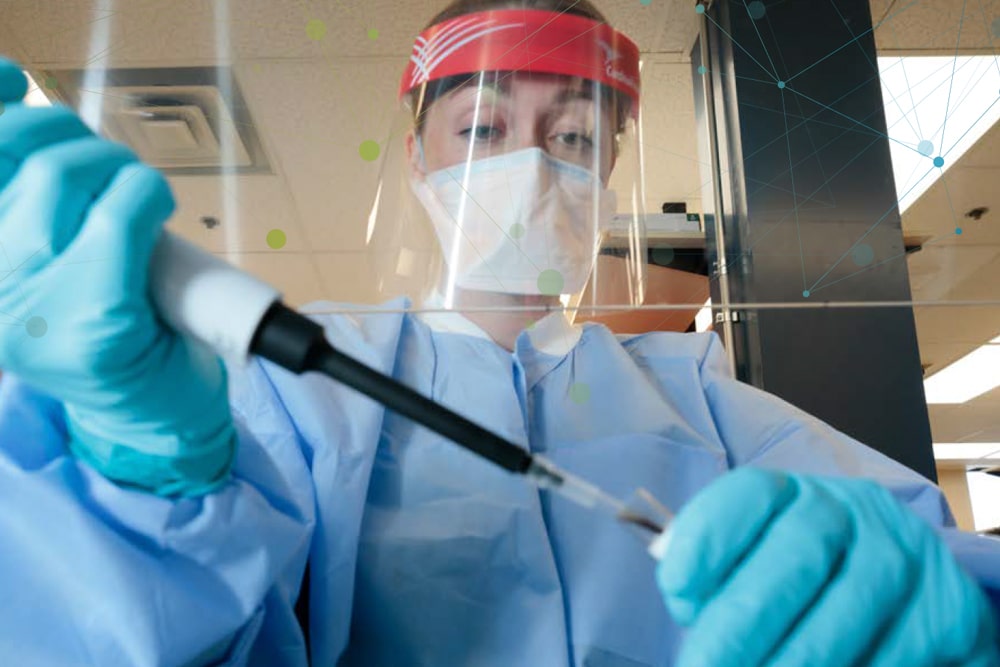 A UNMC researcher pipettes a blood sample for COVID-19 research