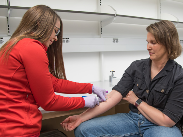 Christina Hoy drawing patient's blood