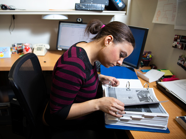 Ebonie Epinger researching at her desk