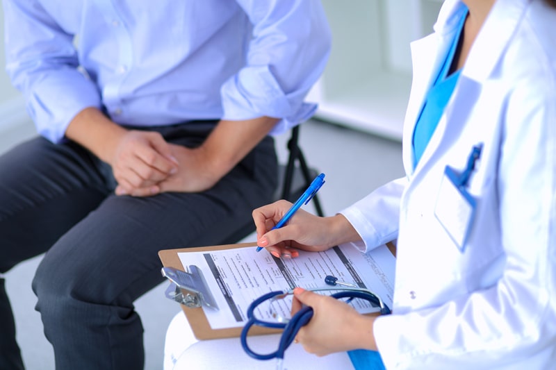 DOCTOR INTERACTING WITH PATIENT