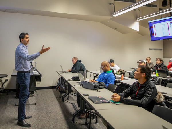 Dr. Robin Gandhi lecturing during class