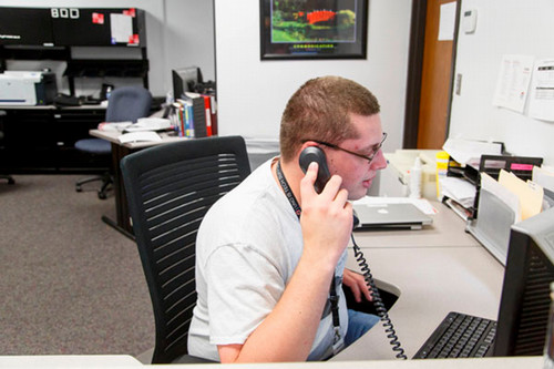 ITS team member answering support calls.