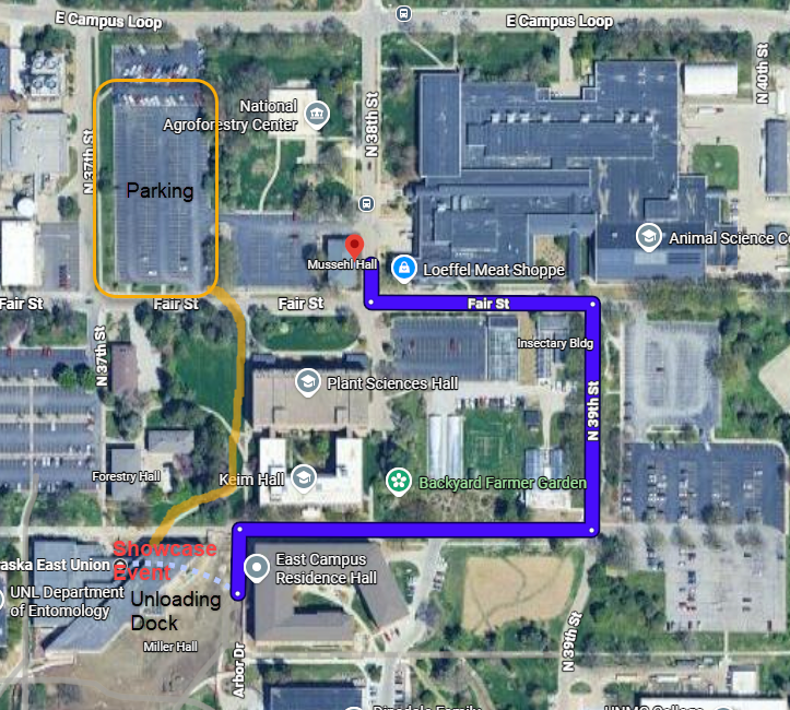 Satellite map of an East Campus area with labeled buildings and streets, showing a highlighted route from East Campus Residence Hall to Munsell Hall and a marked parking lot.