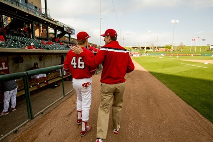 President Bounds at a Husker baseball game with player Nik Miroshnichenko