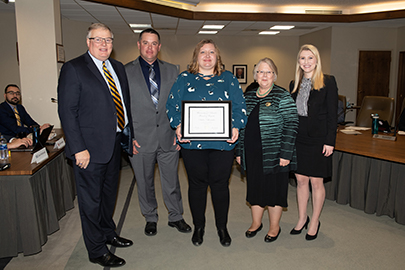 Amber Alexander, Online Program Coordinator for the Department of History at the University of Nebraska at Kearney, receiving her KUDO's award.