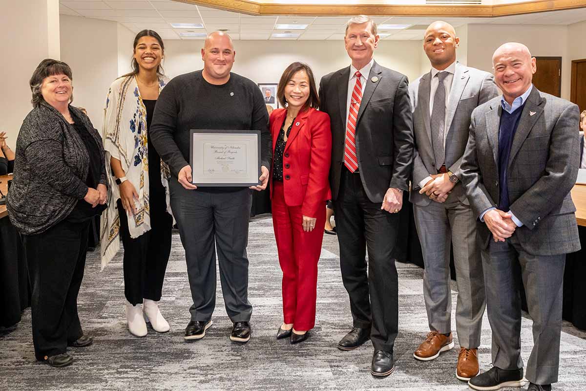 Pictured: Mary Smith, mother; Regent Sims; Michael Smith, recipient; Chancellor Li; President Carter; Adrian Dowell, Vice Chancellor and Director of Athletics; Michael Kemp, Executive Associate Athletic Director.